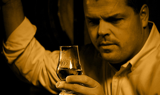 Man pouring bourbon